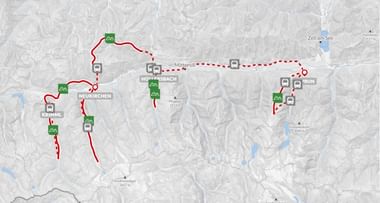 Topografische kaart met fietsroutes in de Hohe Tauern regio met doorgetrokken en gestippelde rode lijnen tussen plaatsen als Neukirchen, Mittersill en Matrei.