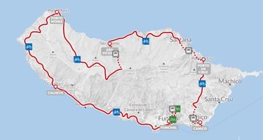 Kaart van Madeira met een in rood gemarkeerde fietsroute die steden zoals Porto Moniz, Santana, Funchal en Câmara de Lobos verbindt.
