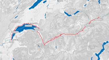 Kaart van Zwitserland met rode route van Andermatt via Oberwald, Brig, Martigny naar Lausanne en Genève. Blauwe gebieden tonen meren en wateren.