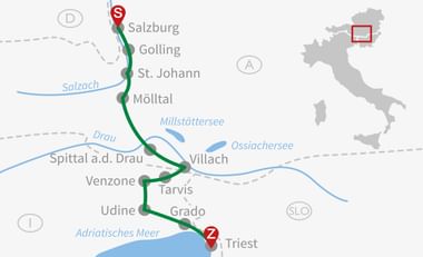 Kaart met fietsroute van Salzburg (S) naar Triëst (Z) door Oostenrijk en Italië, langs steden als Golling, St. Johann, Villach en Udine.