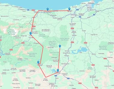 Kaart met fietsroute door Castilië naar Golf van Biskaje in Noord-Spanje, gemarkeerd met rode lijn en blauwe locatieaanduidingen.