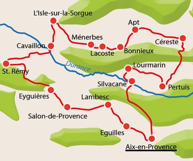 Kaart van de Luberon-Provence regio met rode fietsroutes die steden zoals Apt, L'Isle-sur-la-Sorgue, Bonnieux en Aix-en-Provence verbinden.