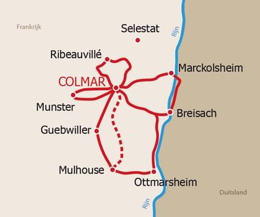 Colmar sterreis kaart in de Elzas regio Kaart met Colmar als centraal punt en rode routes naar nabijgelegen steden: Ribeauvillé, Munster, Guebwiller, Mulhouse, Ottmarsheim, Breisach en Marckolsheim langs de Rijn.