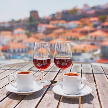Enjoy Madeira wine and coffee on a terrace in Funchal