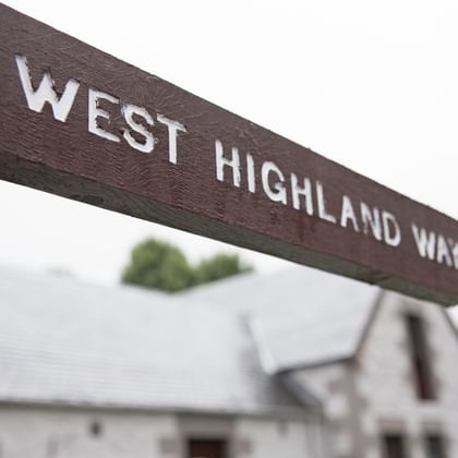 Hiking sign of the West Highland Way at Beinglas Farm