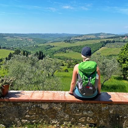 Hiker with the view of beautiful San Leolino in Tuscany