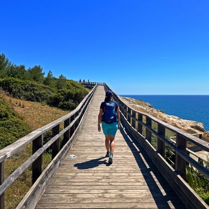 Hiker on coastal hiking trail in the Algarve