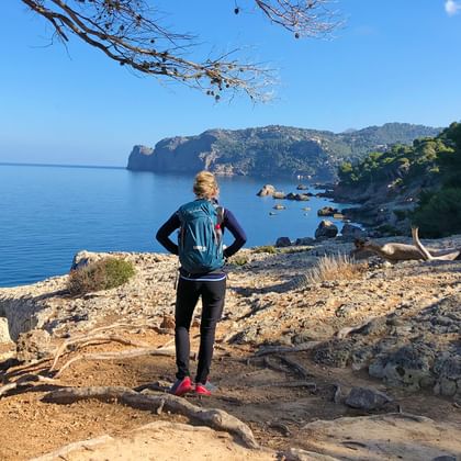 Mallorca sea view with hiker from behind