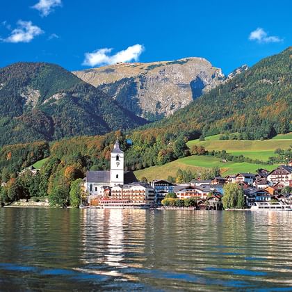 Relaxed hiking at lake Wolfgangsee with view to St. Wolfgang